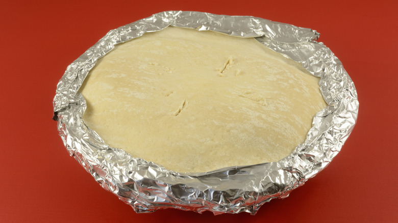 Foil around edges of a frozen pot pie