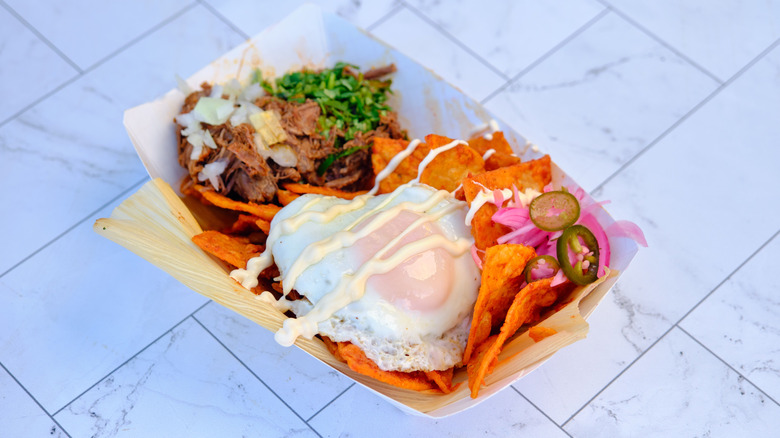 Fried egg with taco ingredients