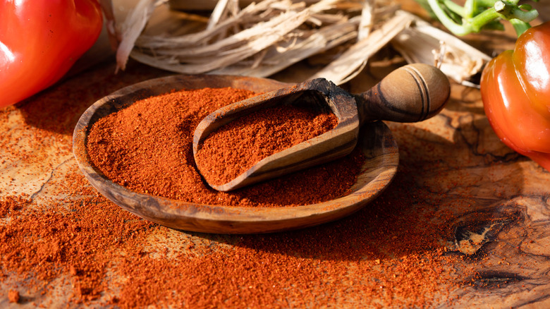 A wooden bowl of paprika