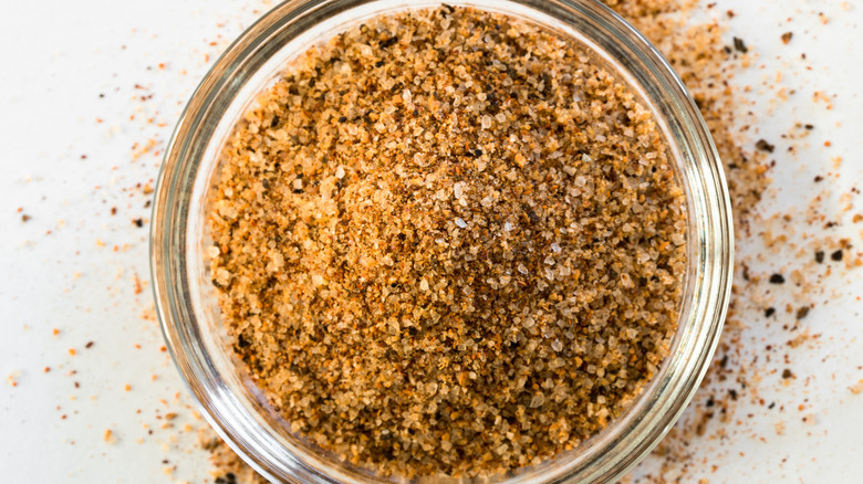 A glass bowl filled with a Cajun seasoning blend