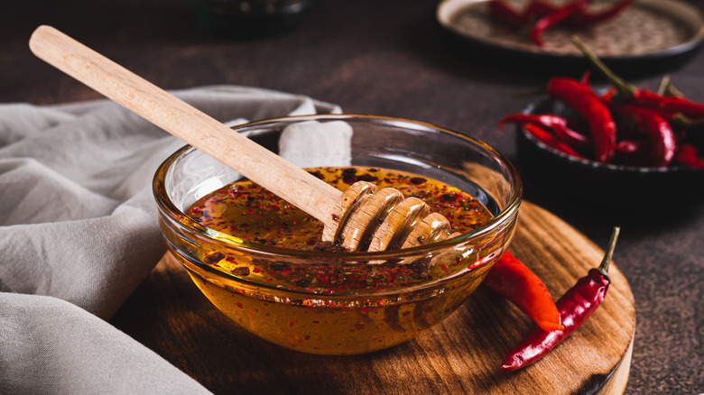 A bowl of honey with spicy chili flakes