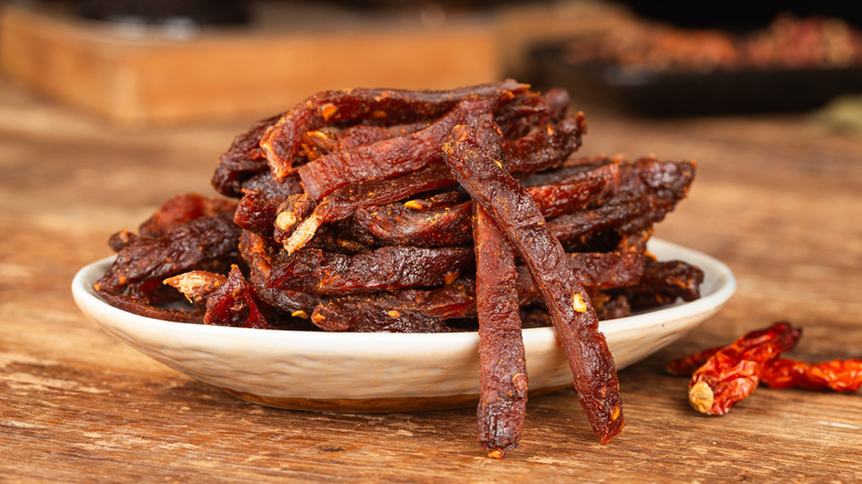 Beef strips, finely chopped beef jerky on a white plate