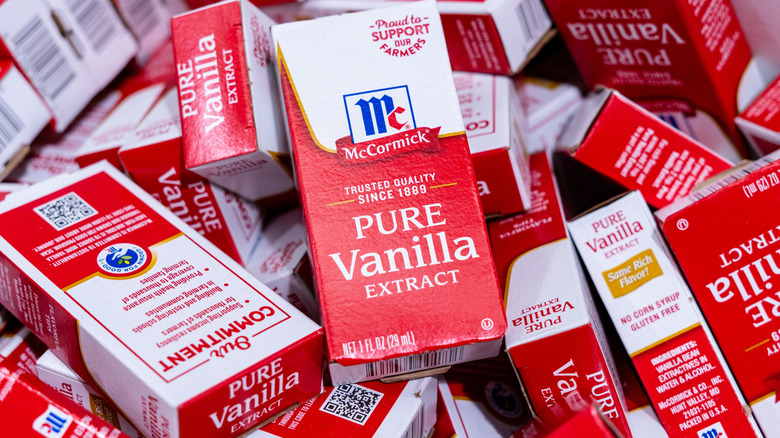 a pile of boxes containing vanilla extract