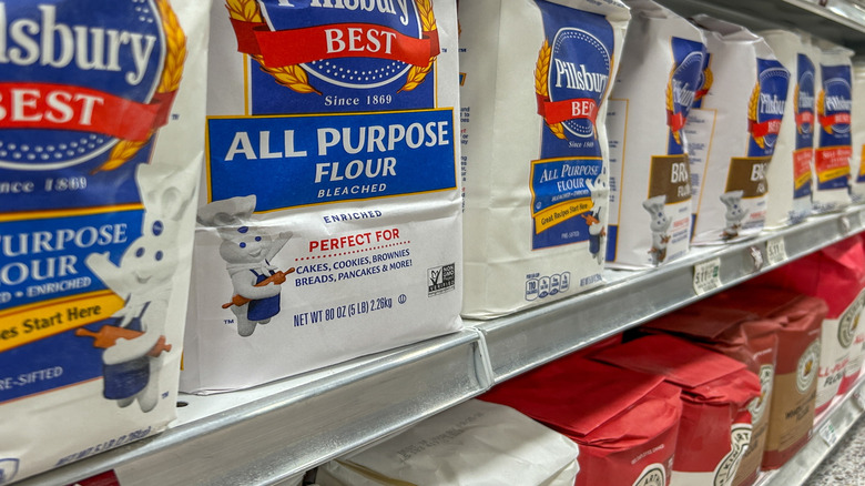 a selection of flour in a grocery store showing brand name products
