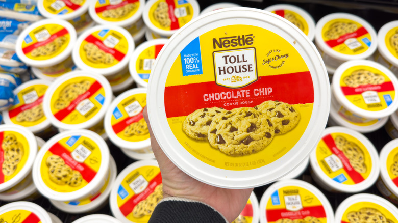 A tub of prepared chocolate chip cookie dough