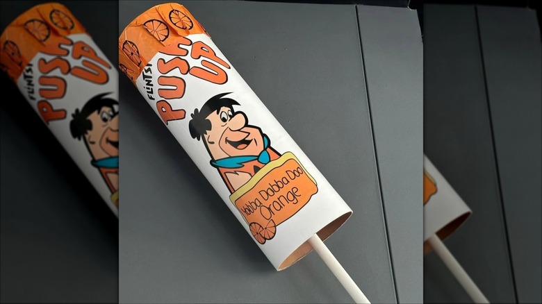 Flintstones Push-Up pop on a table, mirrored