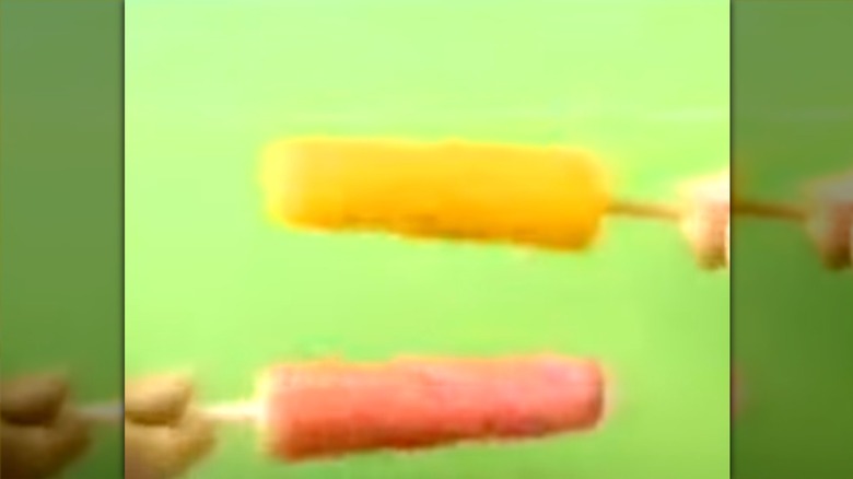 Hands holding Twisters in a '90s ad for the ice pop