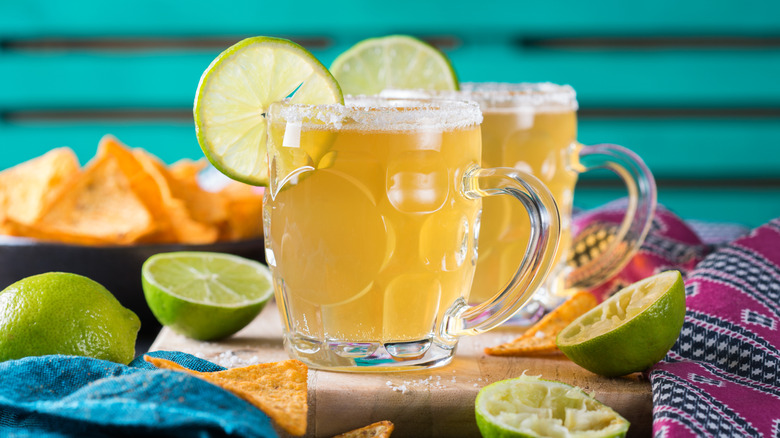 Beer Cocktails in glasses with lime slices and salted rims