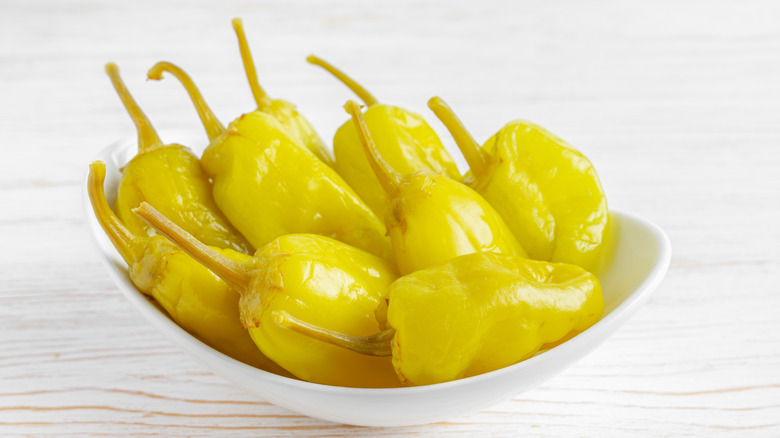 Pepperoncini peppers in white bowl