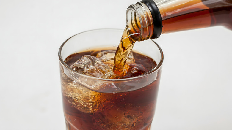 Pouring soda into a glass