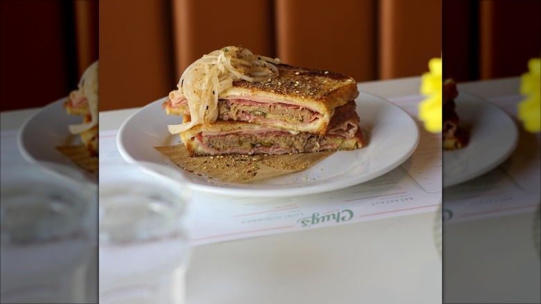Cuban Sandwich topped with onion slices