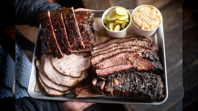 Barbecue platter with smoked meats and sides