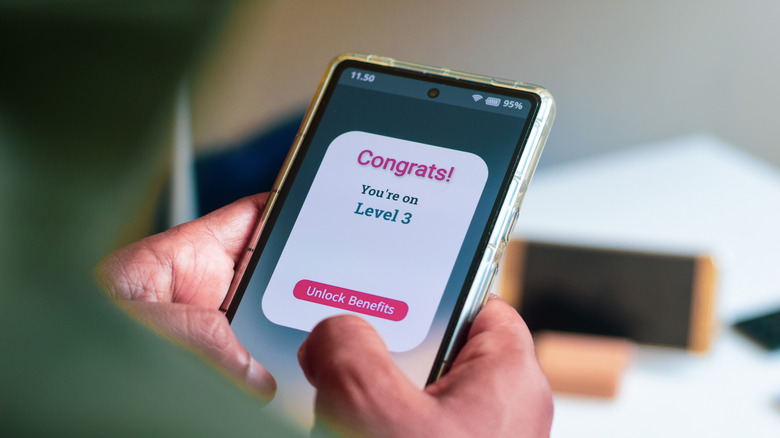 Customer level loyalty rewards concept. Man got a congratulatory message of level up earning