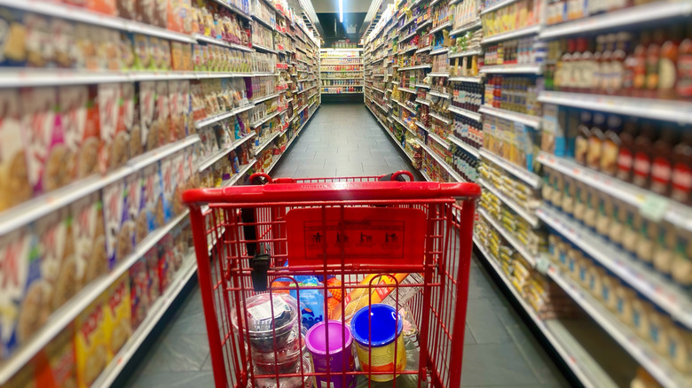 Shopping cart with food in the supermarket