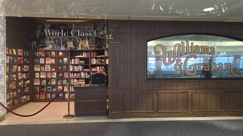 An exterior view of Williams & Graham's airport speakeasy sign and faux bookstore