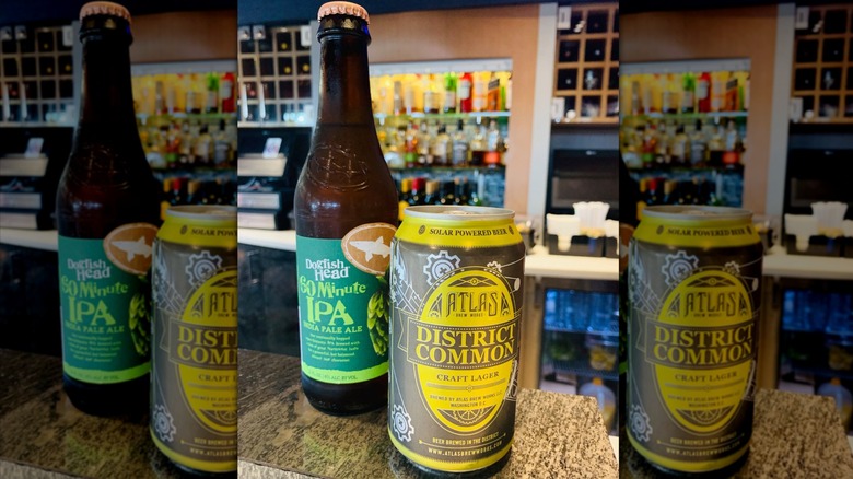 Two beers perched on a bar counter