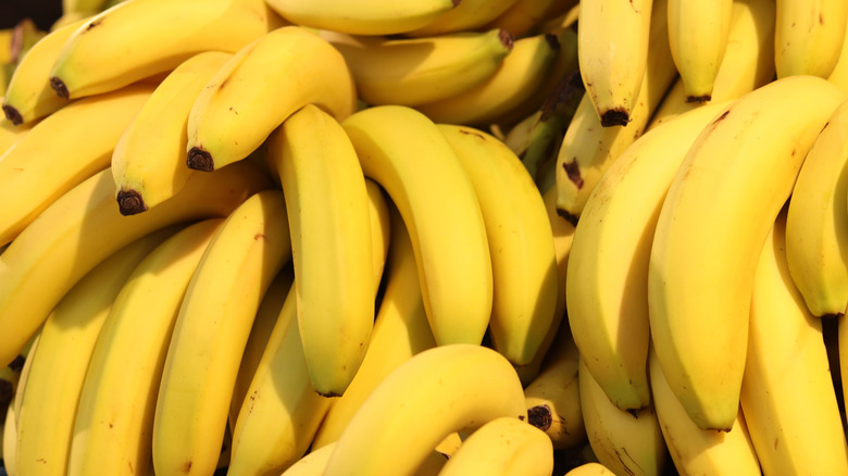 A pile of bunches of bananas