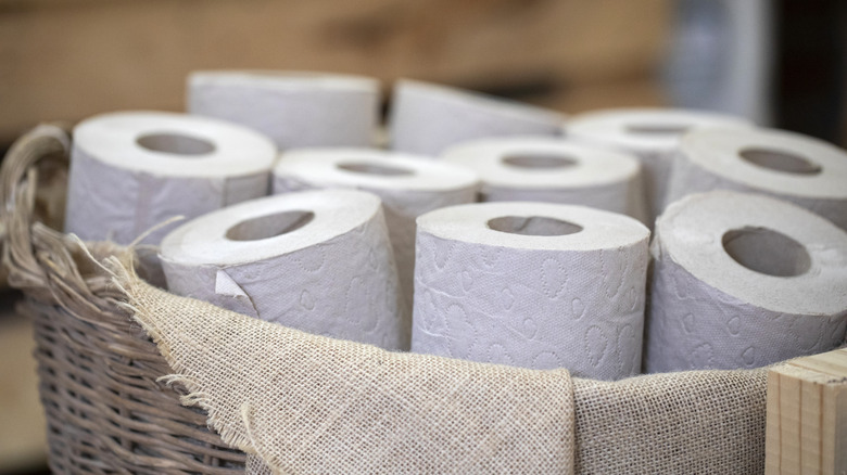 A basket filled with rolls of toilet paper