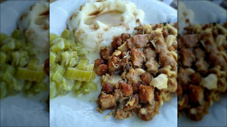 Close up of Amish Wedding Roast with sides of mashed potato with gravy and cooked celery