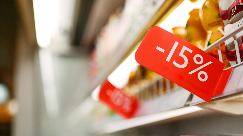 red sales tags on shelves