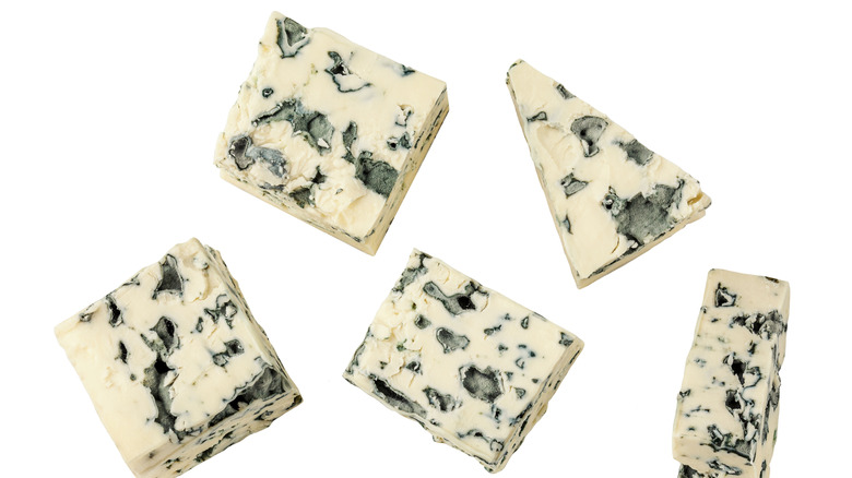 Chunks of blue cheese isolated on a white background
