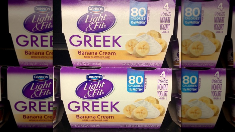 Dannon Light and Fit banana cream yogurt containers on store shelf