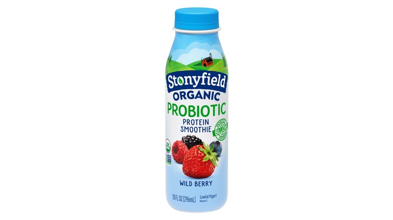 Stonyfield organic probiotic wild berry yogurt in blue and white bottle on white background