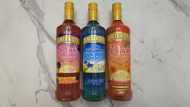 Bottles on Smirnoff flavored lemonades on marble