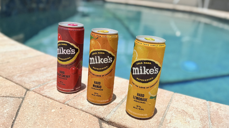 Cans of Mike's Hard Lemonade by the pool