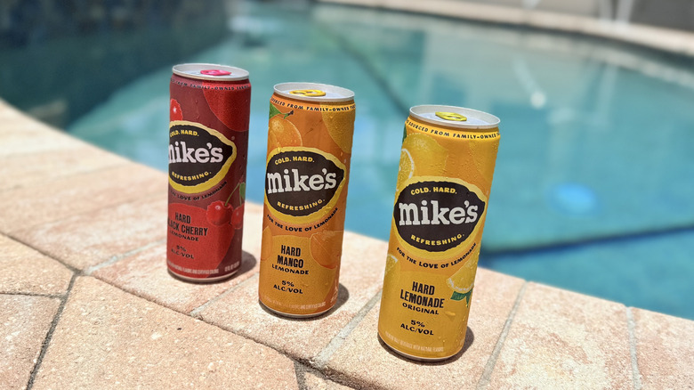 Cans of Mike's Hard Lemonade by the pool