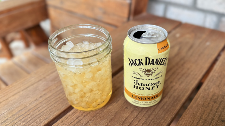 Jack Daniel's Honey lemonade on wooden outdoor furniture