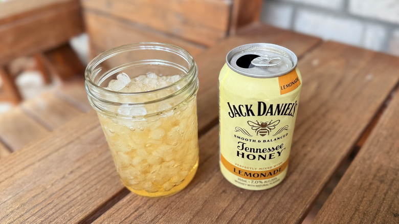 Jack Daniel's Honey lemonade on wooden outdoor furniture