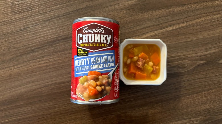 Campbell's Chunky Hearty Bean Soup With Ham in a can and soup in a ramekin