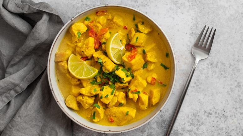 coconut lime chicken in a white bowl