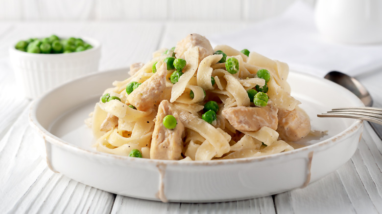 peas in chicken pasta on a plate