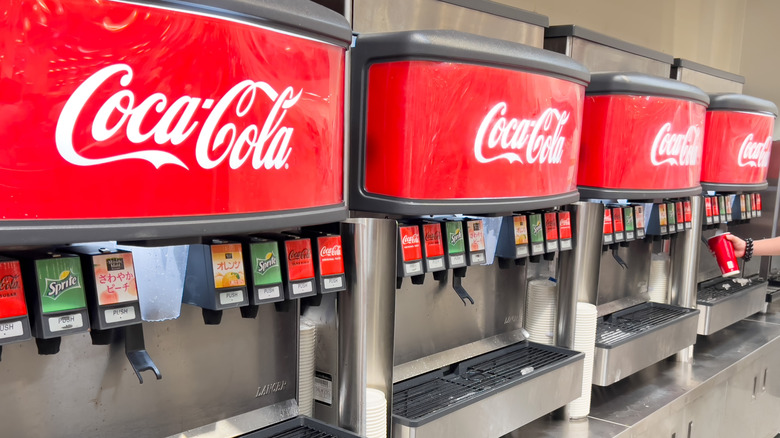 A Costco Beverage Station dispensing Coke products.