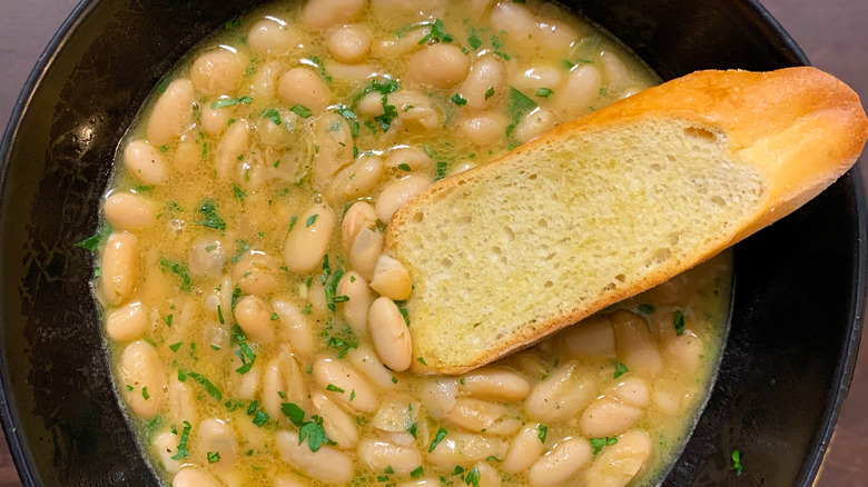 Bowl of white bean soup with bread