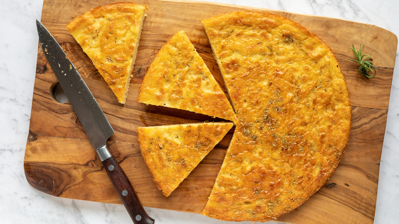 Farinata cut into pieces with rosemary