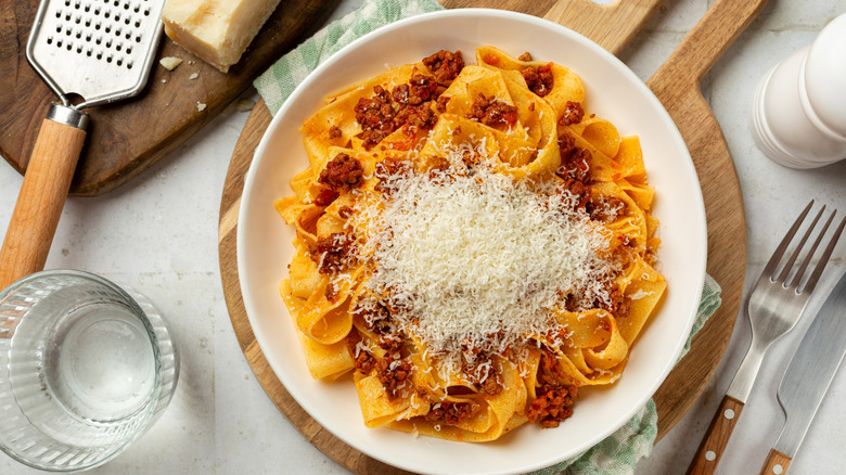 Fresh egg noodle pasta with grated Parmesan cheese on top