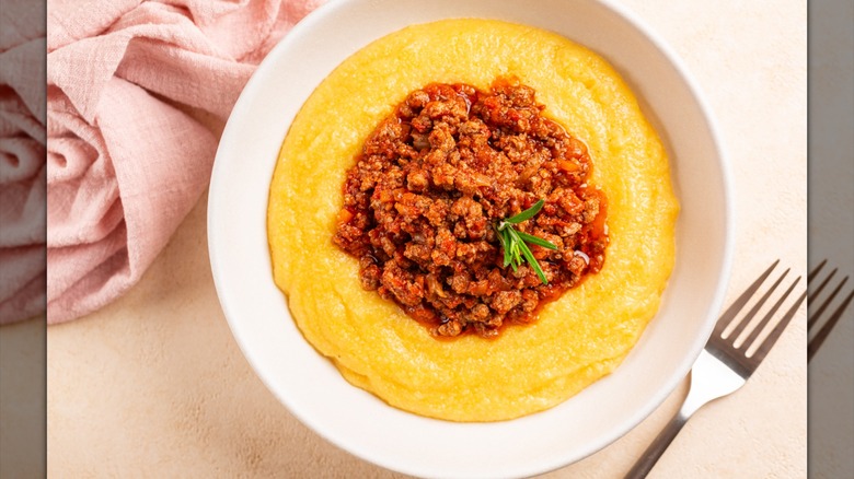 Polenta with red sauce and meat in a bowl