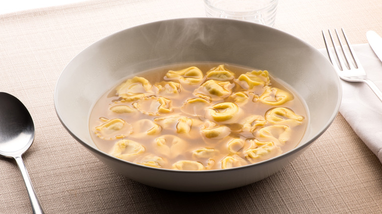 Tortellini with broth in a bowl