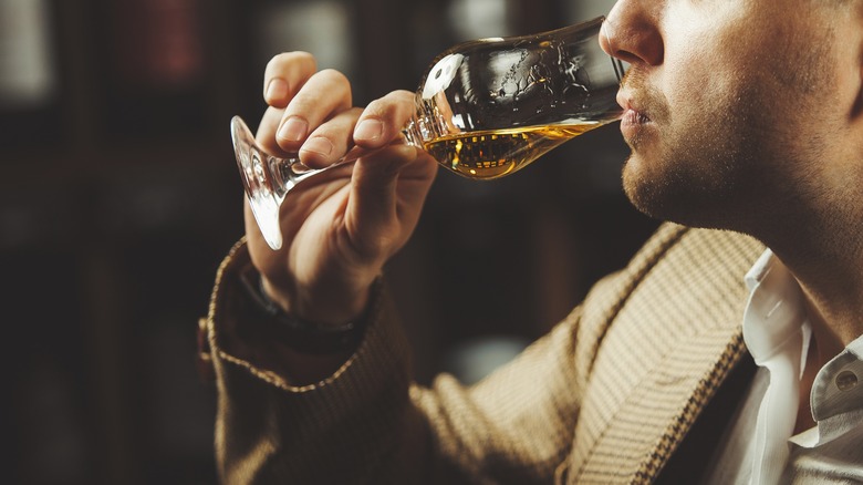 Man tasting whiskey