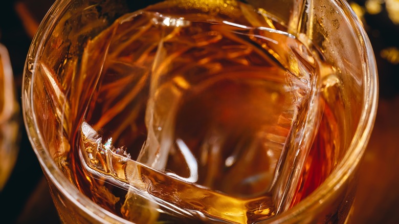Close up of whiskey and ice cube