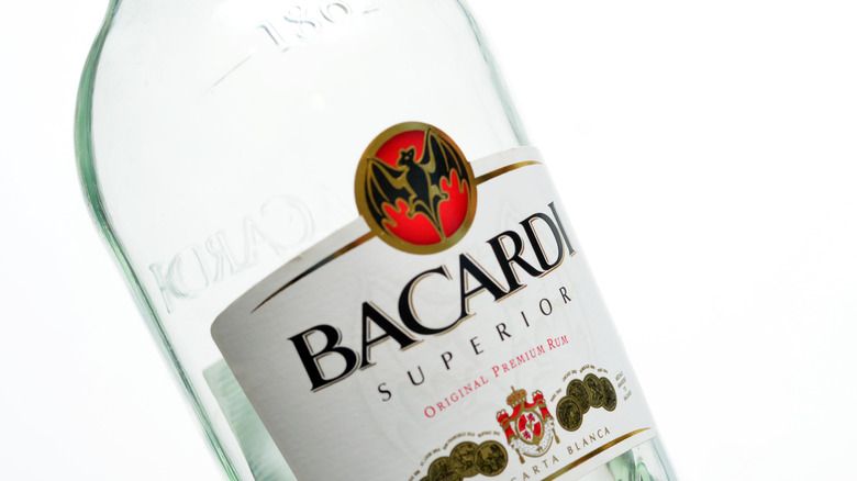 A close-up of a bottle of Bacardi Superior Light Rum on a white background