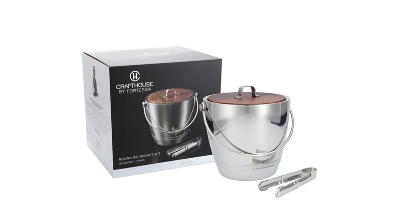 The Crafthouse ice bucket with tongs beside its box on a white background