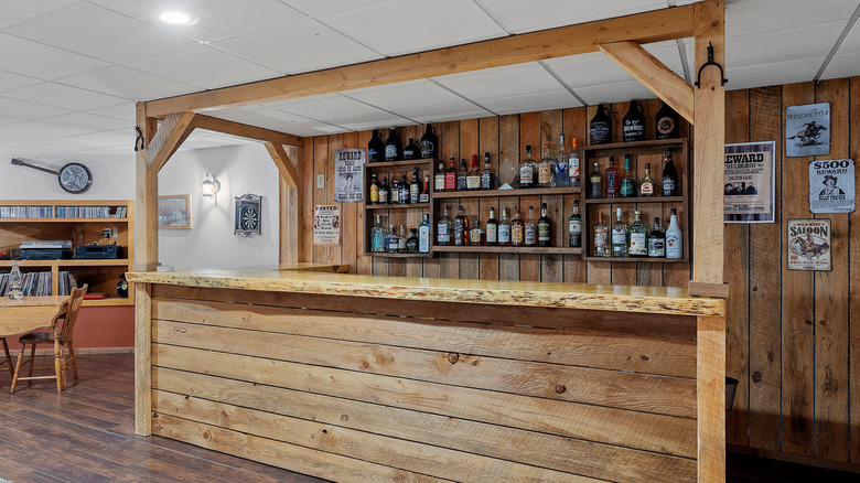 A wooden bar setup inside someone's basement