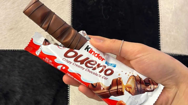 Person holding opened package of Kinder Bueno Bars