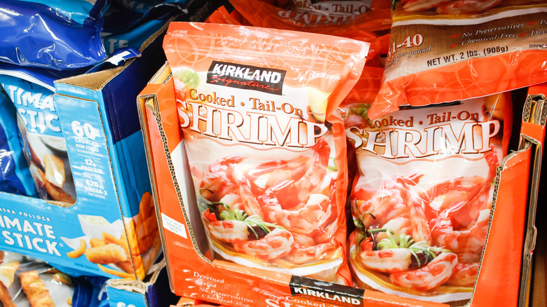 Kirkland Farm Raised Cooked Shrimp Tail-off packages on Costco store shelf