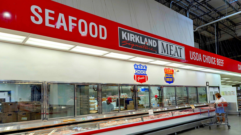 Costco frozen meat section with seafood sign