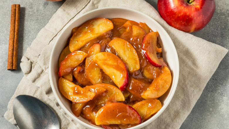 A bowl of gooey baked apples.